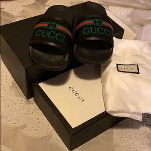 Toddler size Gucci slides.